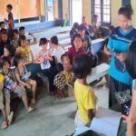 Refugee students receiving small gifts